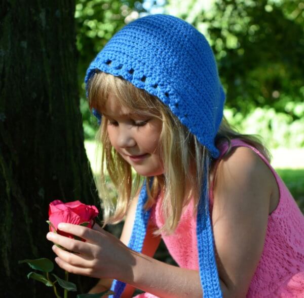 a crochet bonnet by La Visch Designs