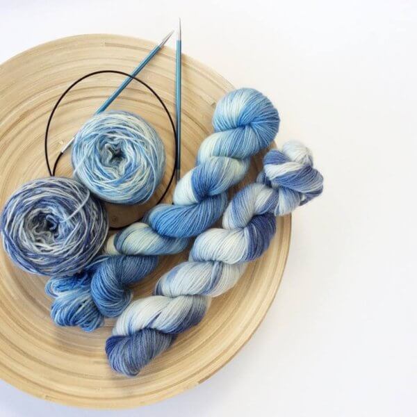 Blue yarn and knitting needles