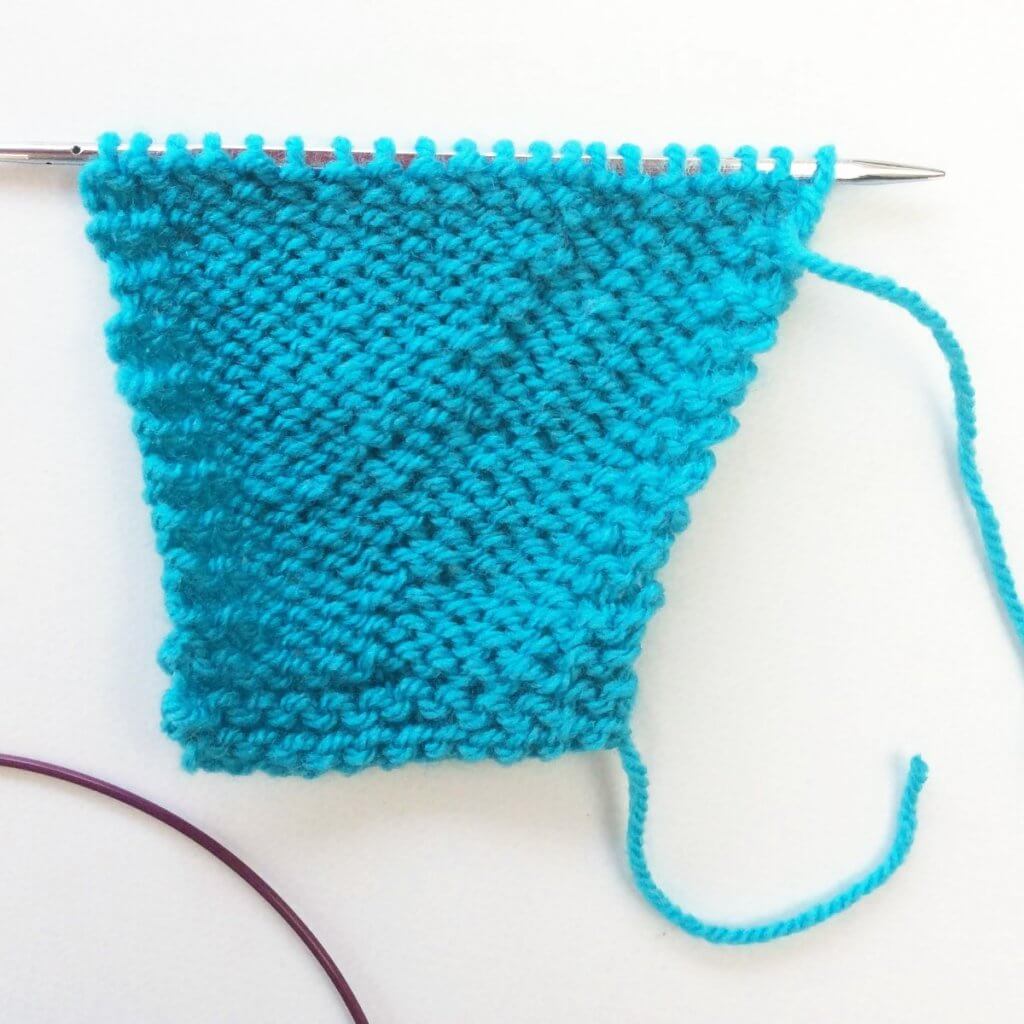 Tutorial working a purl-side Right-Leaning Lifted Increase (RLIP)