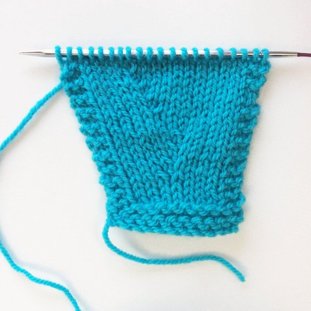 Tutorial working a purl-side Right-Leaning Lifted Increase (RLIP)