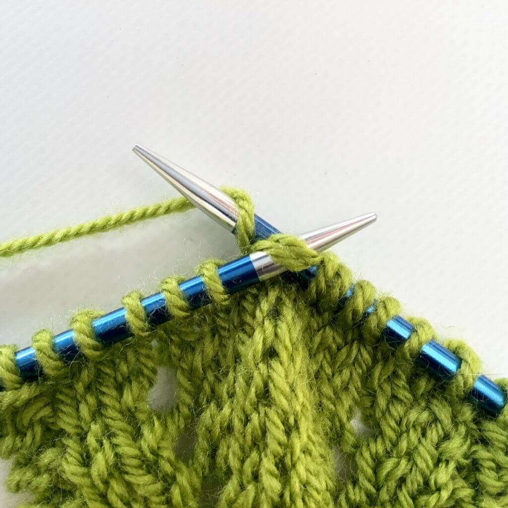 wrap yarn around the needle