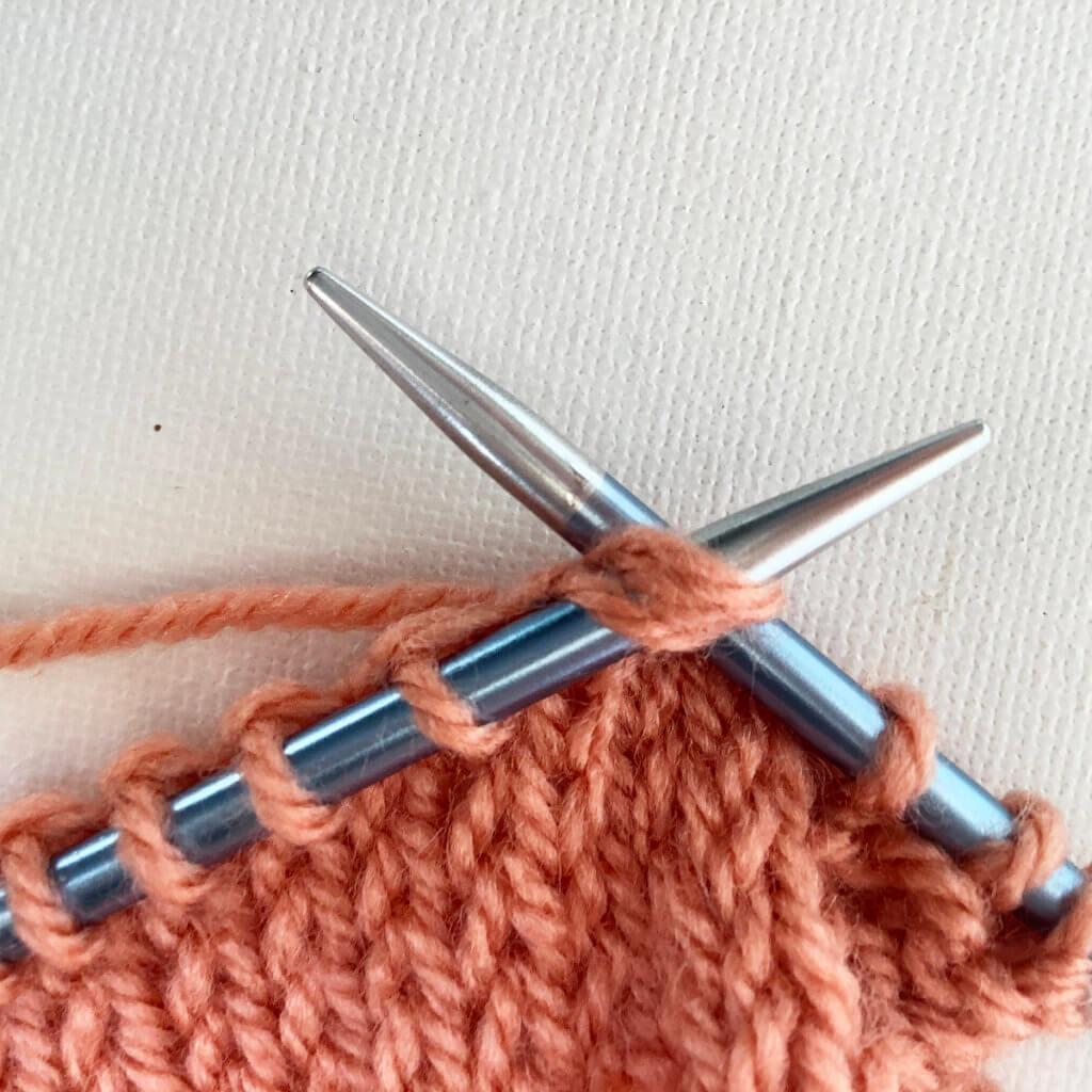 Step 2 in working an Estonian star stitch