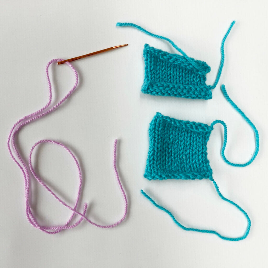 The materials: 2 knitted swatches, and a darning needle threaded with contrasting yarn.