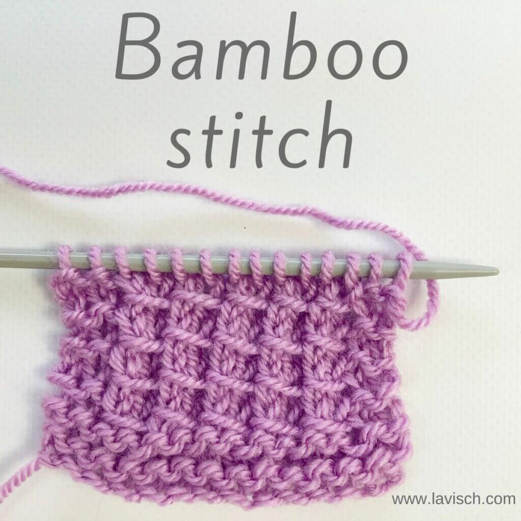 A swatch of bamboo stitch in lilac yarn on a knitting needle.