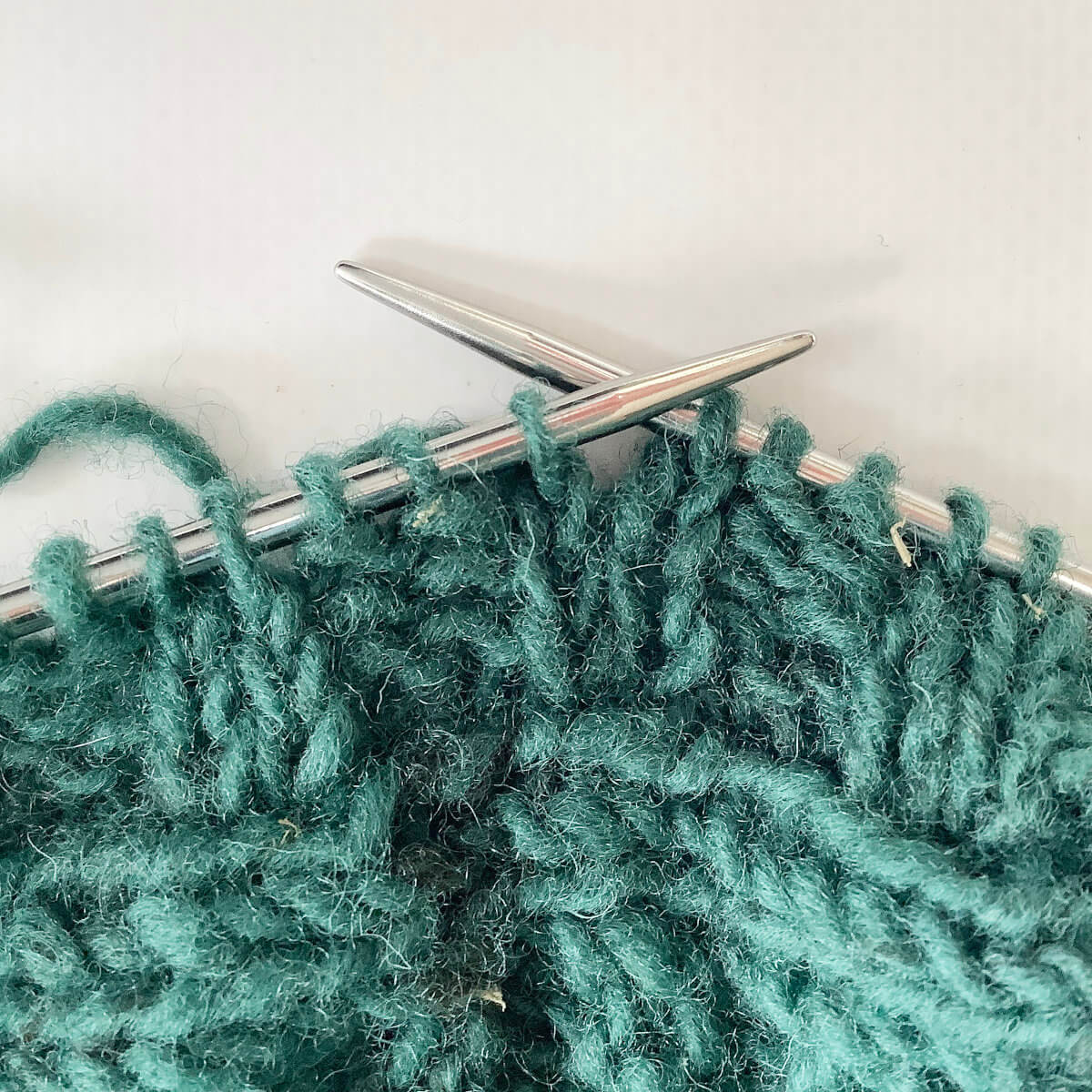 Step 2 of knitting a two-stitch button hole