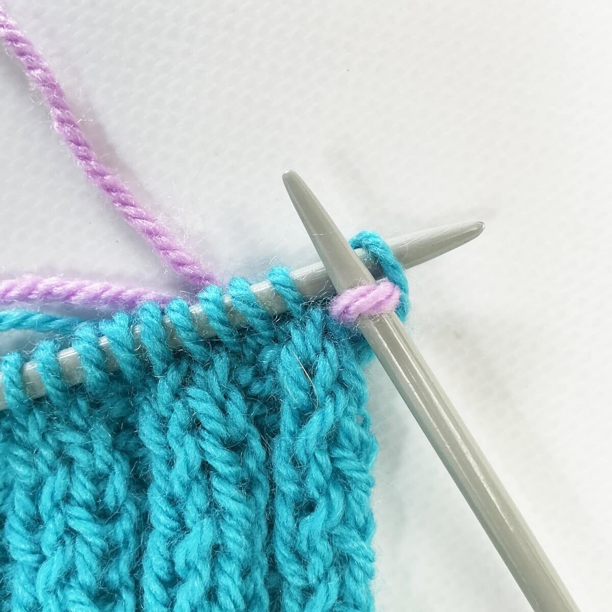 Step 3 of working a Vikkel braid in a contrasting color
