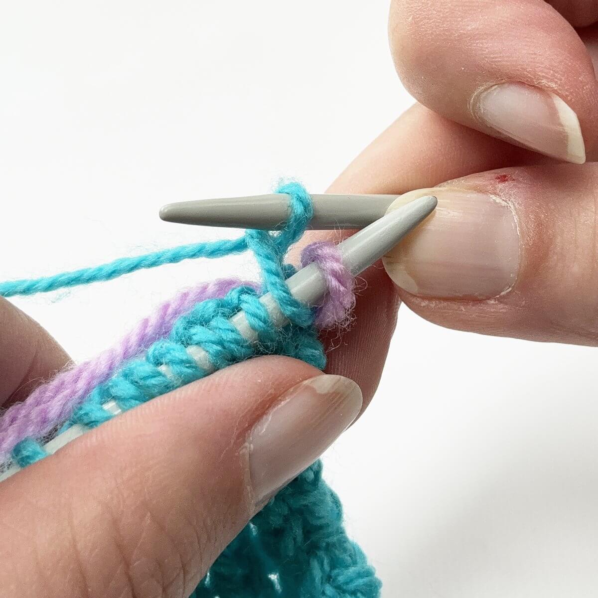 Step 7 of working a Vikkel braid in a contrasting color
