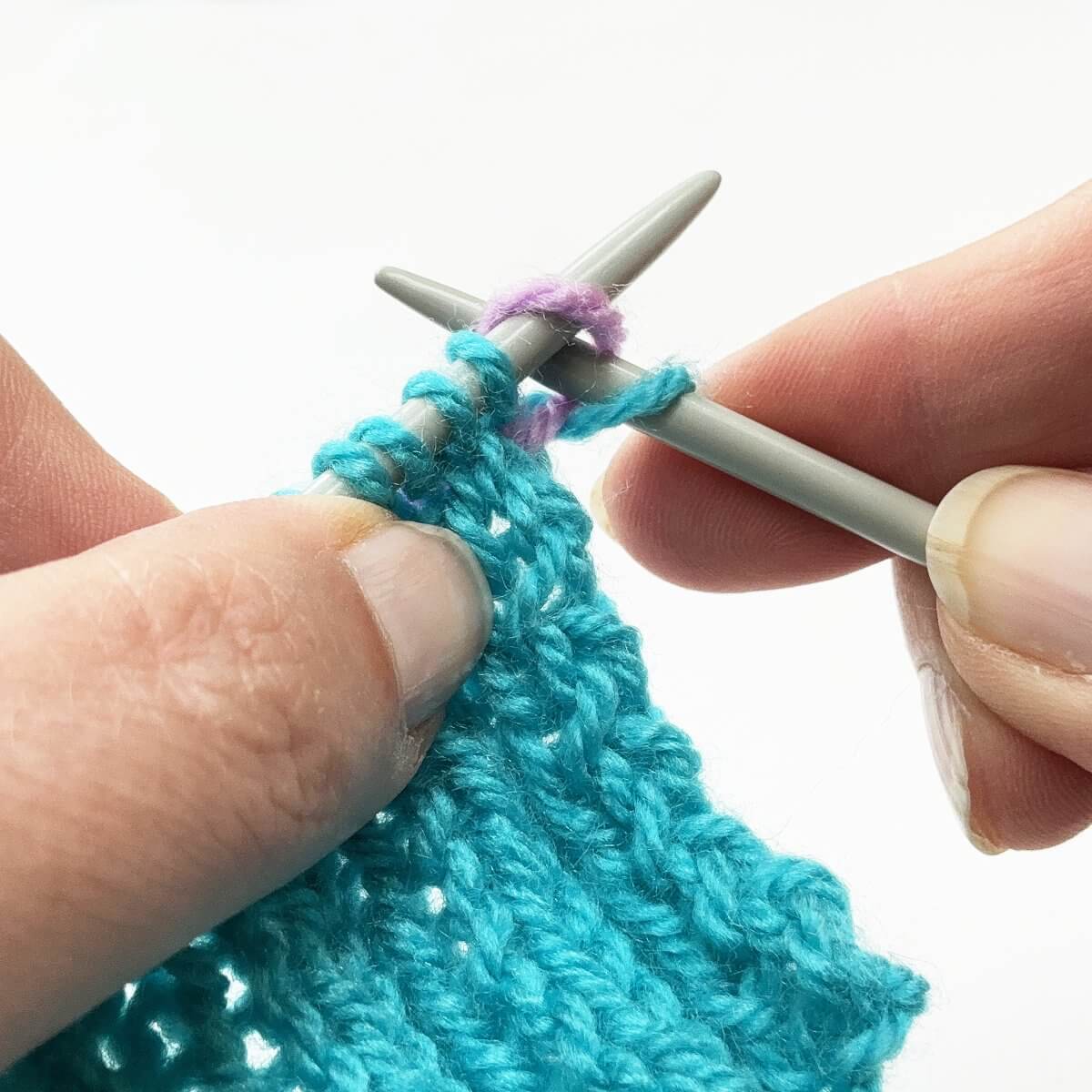 Step 8 of working a Vikkel braid in a contrasting color