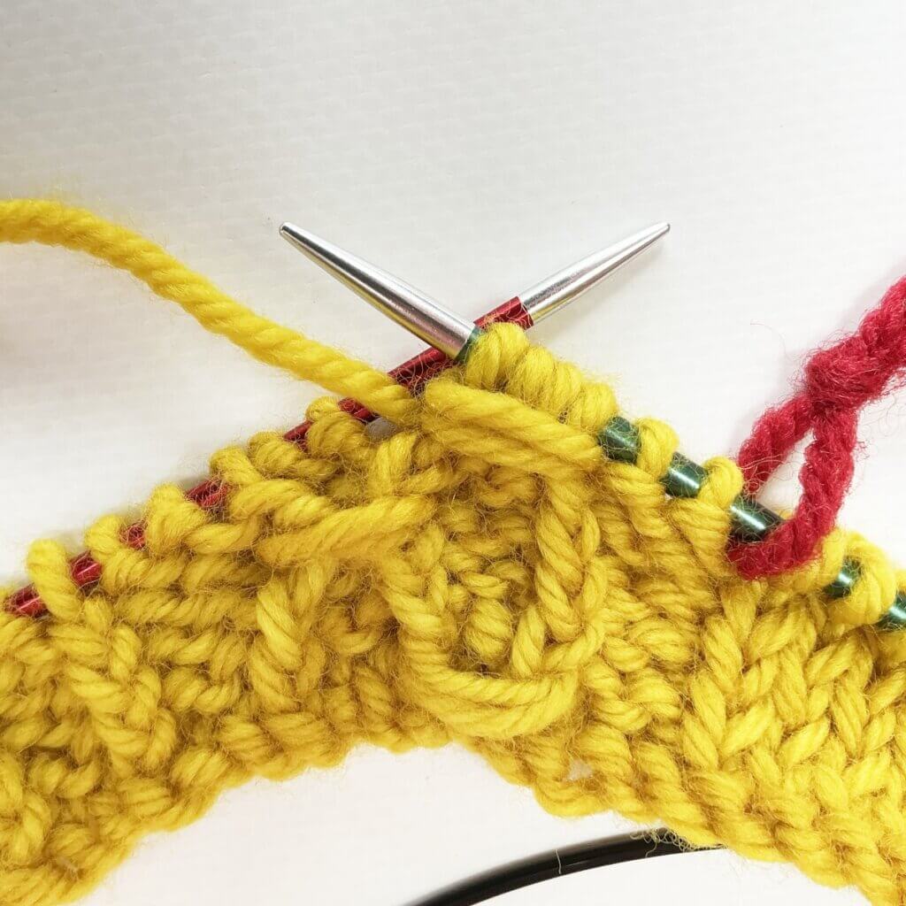The result of working the (k tbl, yo, skp, k tbl) wrapped twice stitch