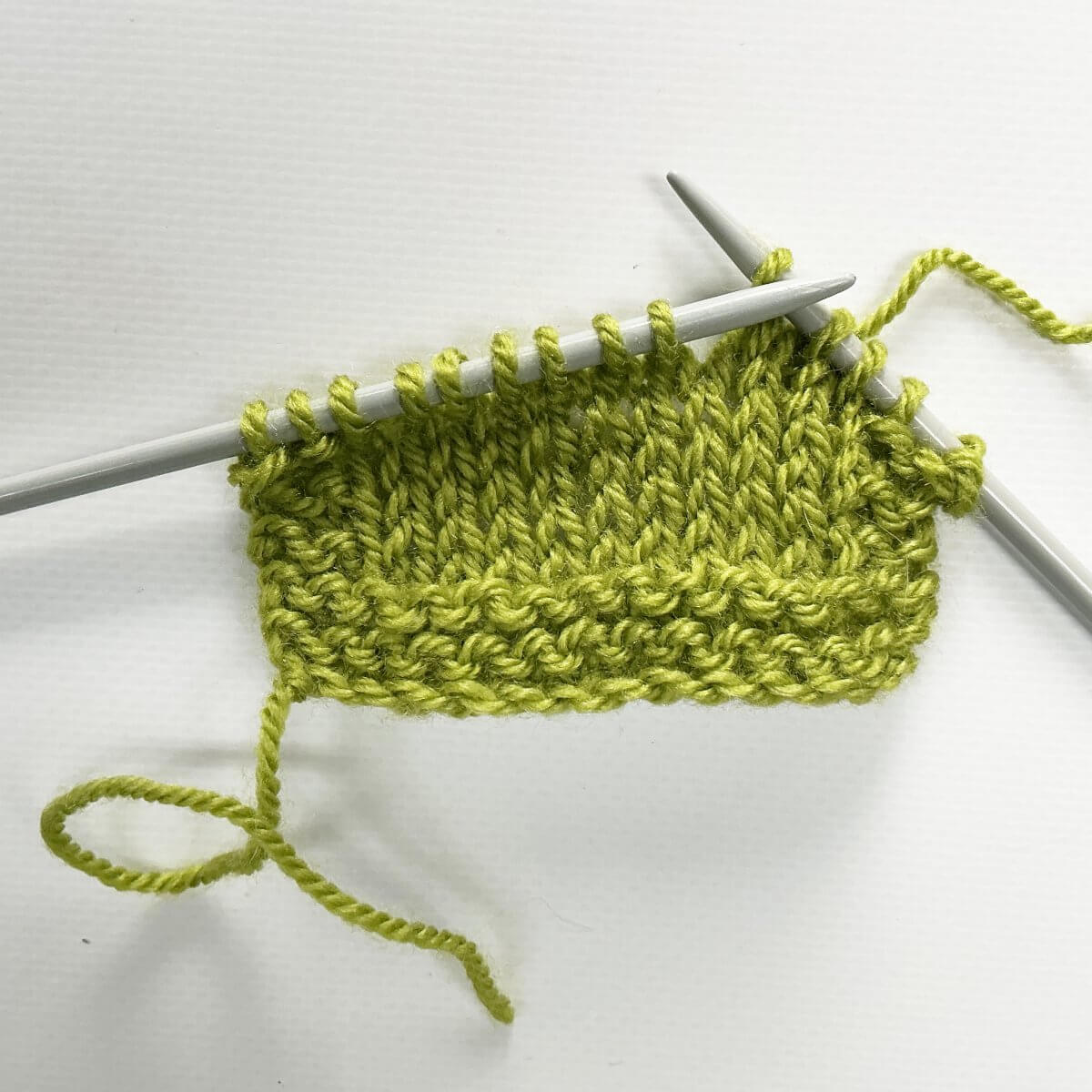 Step 1 of working the k4tog bf decrease