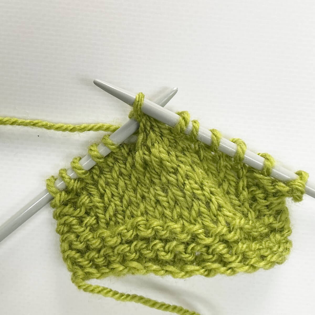 Step 7 of working the k4tog bf decrease