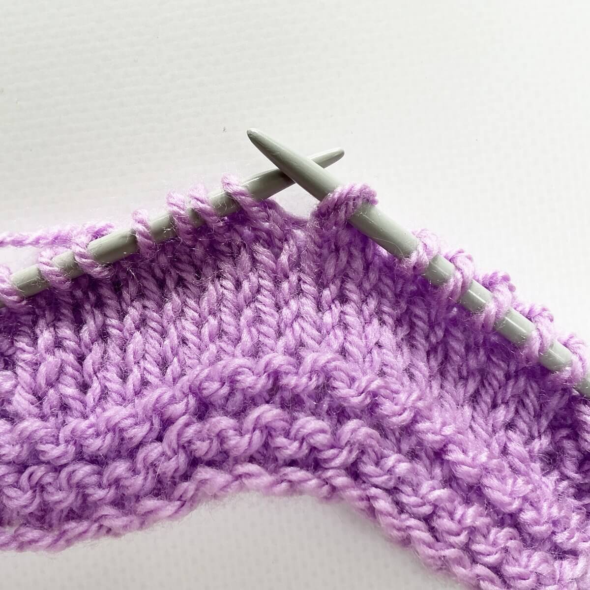 Step 3 of working a sl2-k2tog-p2sso decrease