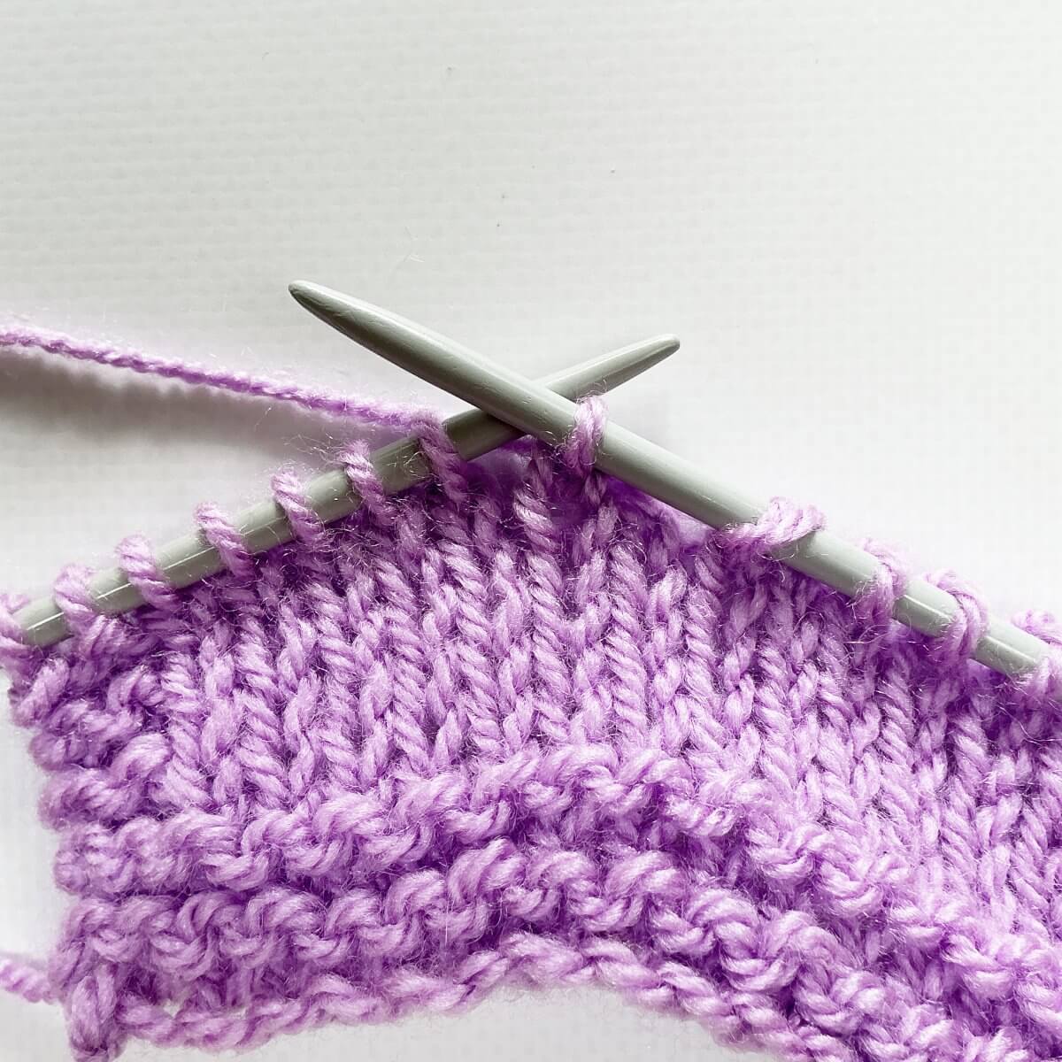 Step 7 of working a sl2-k2tog-p2sso decrease