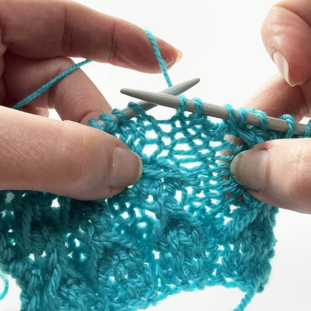 Step 1 - pulling the stitches apart to make the space below the third bar visible