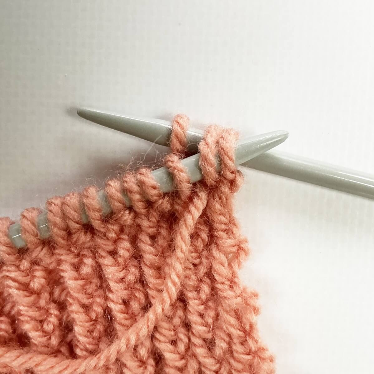 Step 5 of working the stretchy YO bind-off for 1x1 rib.