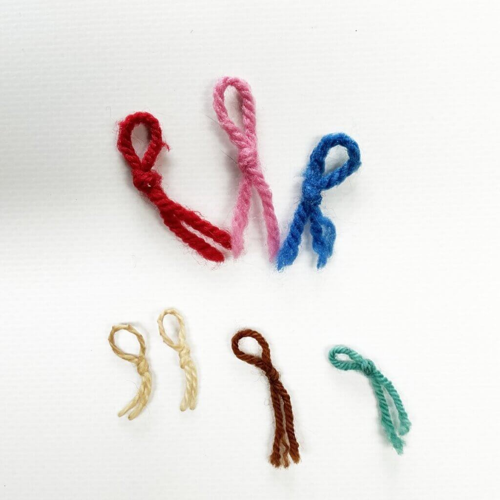 Looped yarn stitch markers