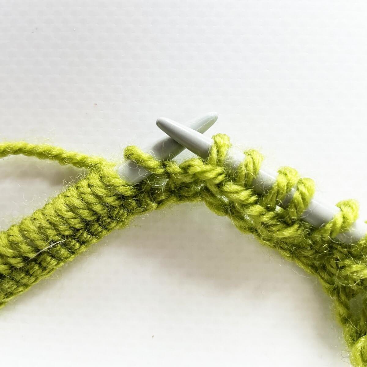 Step 1 of knitting a bobble