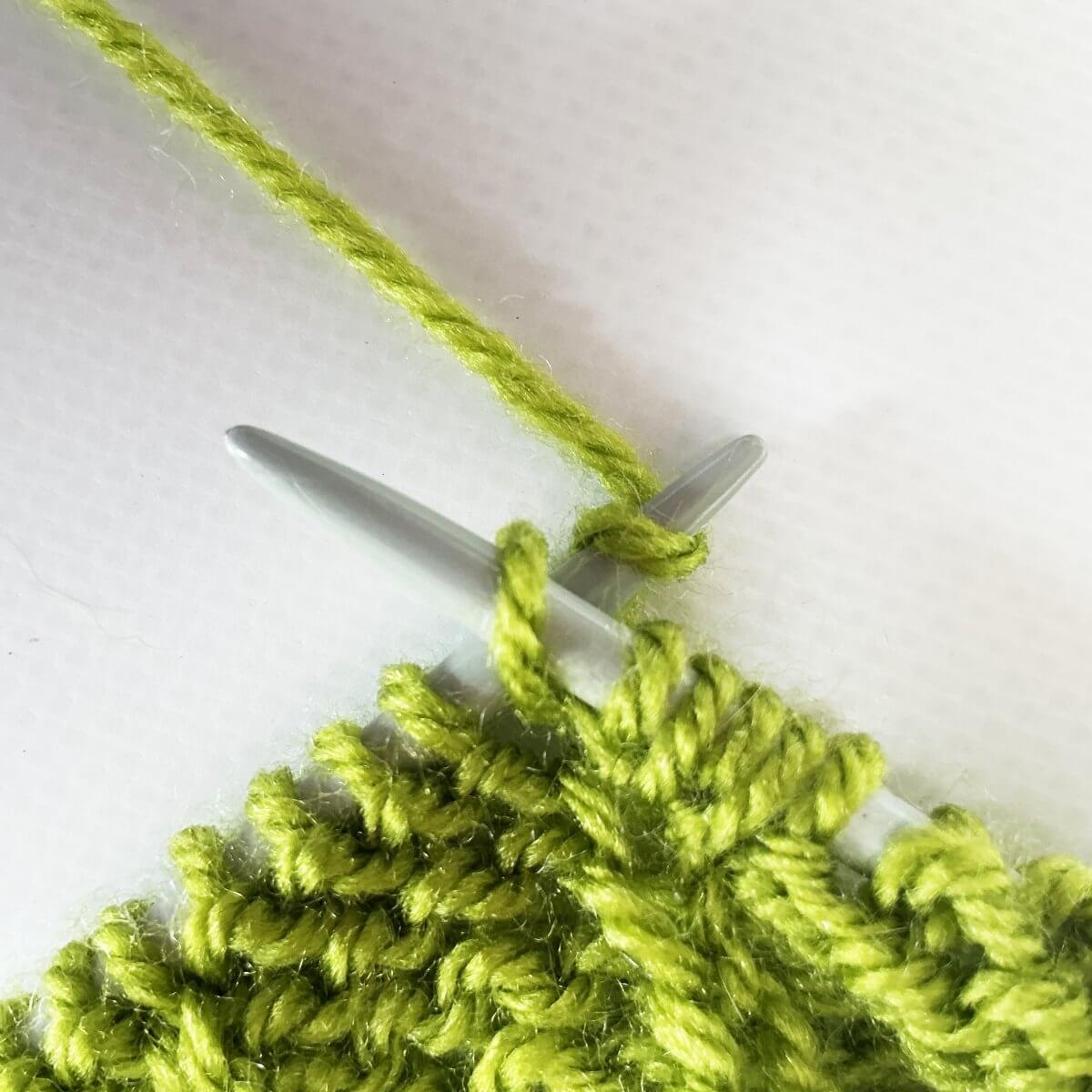Step 3 of knitting backwards