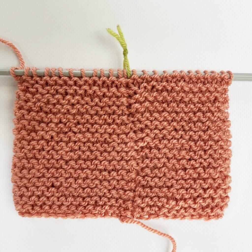 The result of working jog-less garter stitch in the round with the sl1 wyif method